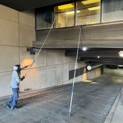 In Action Window Washing Entryway toward the Parking Garage at the Convention Center in Chattanooga TN by QualityPRO Power Washing