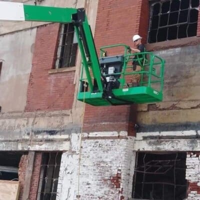Using a Lift to Actively Clean and Pressure Wash and Abandoned Warehouse in Chattanooga TN by QualityPRO Power Washing
