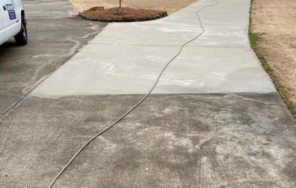 Before & after concrete driveway pressure washing in Chattanooga TN by QualityPRO Power Washing