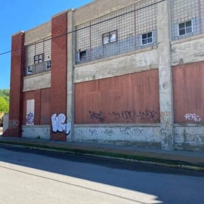 Before Graffiti Removal at unoccupied industrial building by pressure Washing in Chattanooga TN by QualityPRO Power Washing