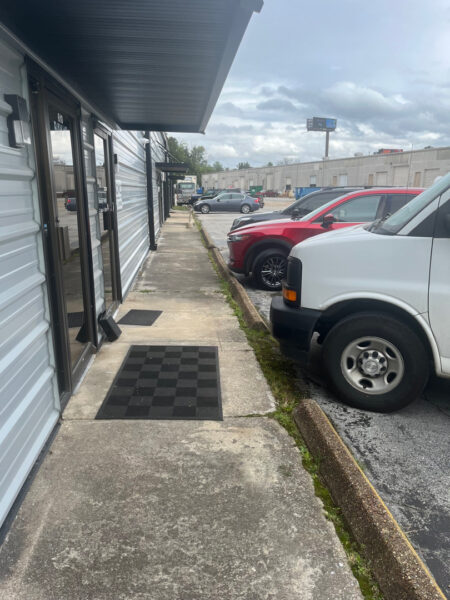 This project involved the complete removal of moss and debris followed by a detergent treatment and pressure rinse to restore the cleanliness and drainage of a curbside and asphalt parking lot in Chattanooga, TN.