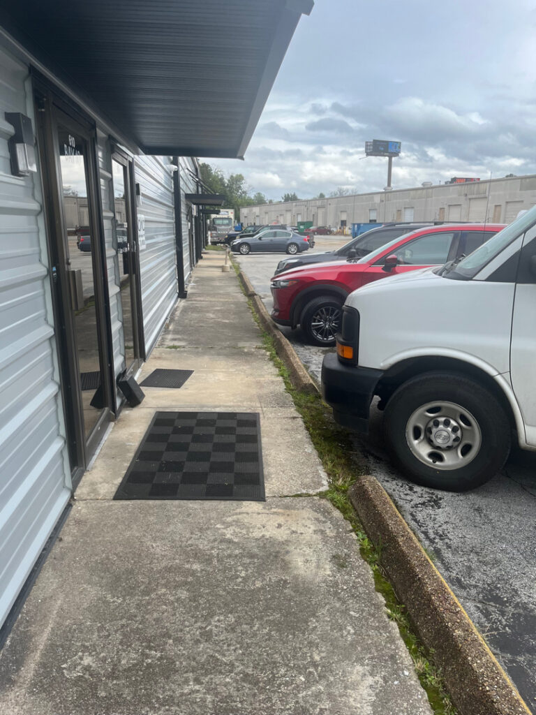 This project involved the complete removal of moss and debris followed by a detergent treatment and pressure rinse to restore the cleanliness and drainage of a curbside and asphalt parking lot in Chattanooga, TN.