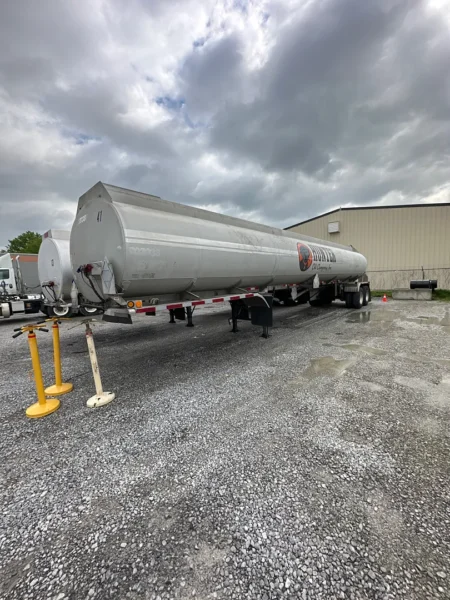 Fleet pressure washing completed on tanker trailers and a service truck, removing heavy road film, grime, and buildup to restore a brighter, cleaner finish and a more professional fleet appearance.