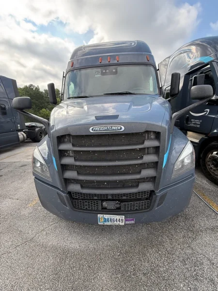 Pressure washing service completed on multiple semi trucks, focusing on the front end and upper cab areas to remove road film, grime, and buildup—leaving a cleaner, brighter finish and a more professional fleet appearance.