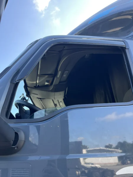 Pressure washing service completed on multiple semi trucks, focusing on the front end and upper cab areas to remove road film, grime, and buildup—leaving a cleaner, brighter finish and a more professional fleet appearance.