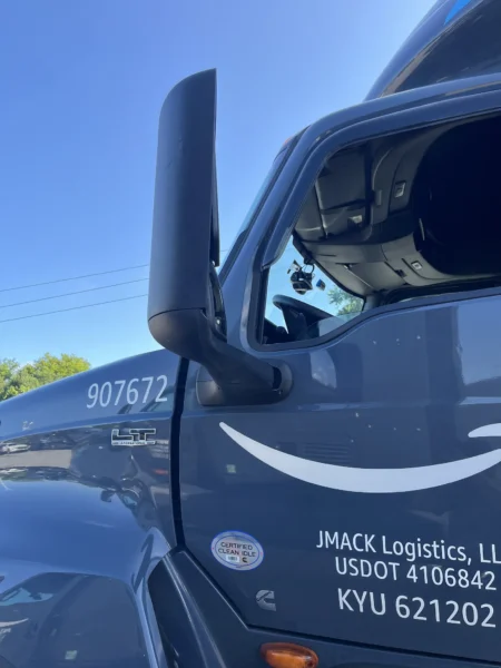 Pressure washing service completed on multiple semi trucks, focusing on the front end and upper cab areas to remove road film, grime, and buildup—leaving a cleaner, brighter finish and a more professional fleet appearance.