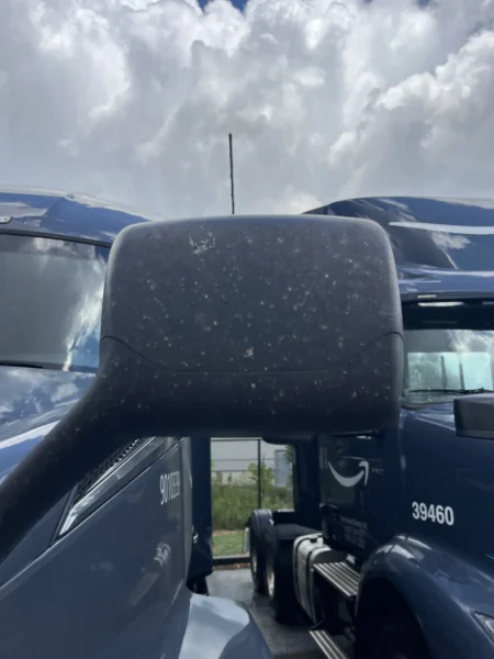 Pressure washing service completed on multiple semi trucks, focusing on the front end and upper cab areas to remove road film, grime, and buildup—leaving a cleaner, brighter finish and a more professional fleet appearance.