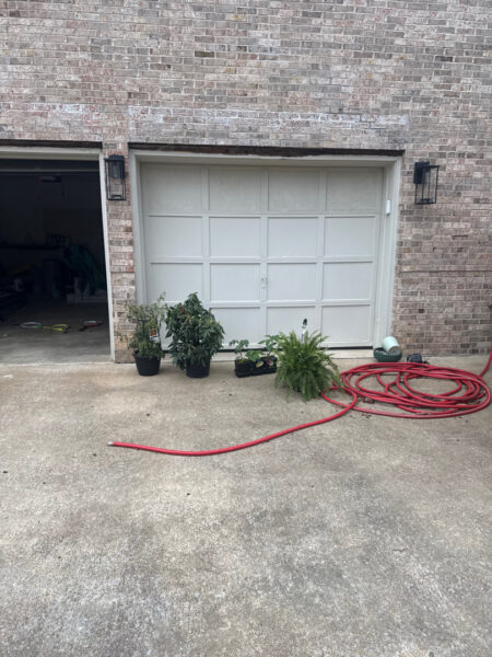 The work performed consists of soft washing and rinsing the primary structure's exterior surfaces, three rear decks, a treehouse with its decks and bridges, and surface cleaning the concrete flatwork, all backed by a one-year warranty against mold and mildew regrowth.