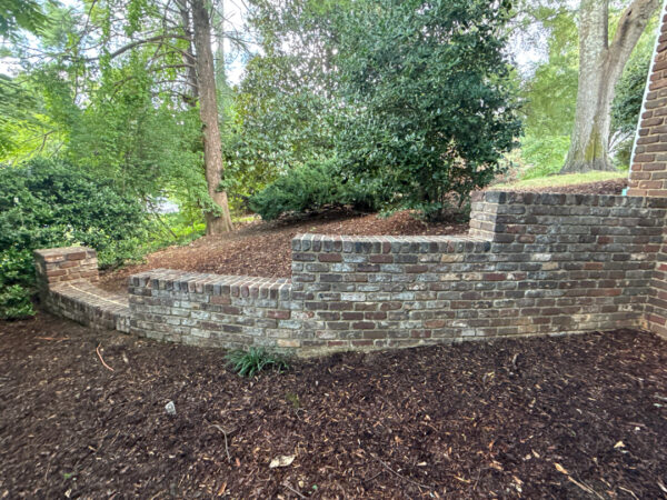 This project involved a comprehensive soft wash and detailed exterior cleaning of a Chattanooga residence, encompassing the house, porches, concrete surfaces, gutters, and outbuildings to remove organic buildup and restore a uniform appearance.