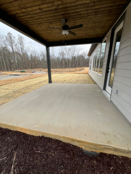 The project involved a comprehensive exterior rinse of a newly constructed home in Chattanooga, including the siding, garage, driveway, and walkways, to remove construction dust and debris for a move-in-ready finish.