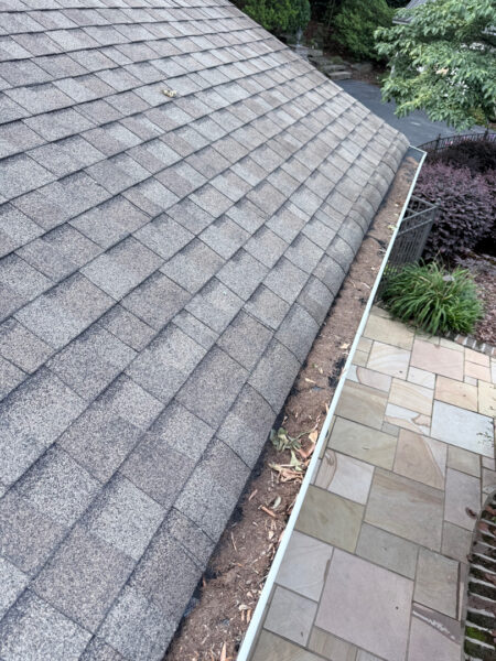 This project involved a comprehensive exterior refresh of a Chattanooga home using soft washing and surface cleaning to safely remove dirt, mold, and residue from the siding, gutters, porches, concrete walkways, brick retaining walls, entryway columns, wooden swing, and stone pool deck.