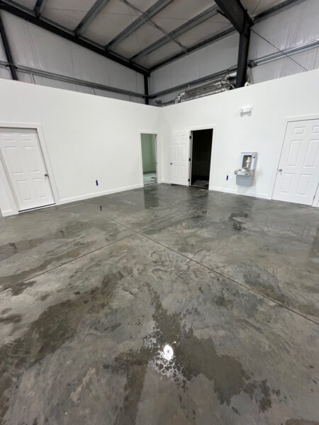 A cleaning of this metal warehouse to remove built-up dirt, grime, and surface staining was done, leaving the slab noticeably cleaner, brighter, and more professional-looking. The wash improved the overall appearance of the space while helping reduce slick residue and making the floor easier to maintain going forward.