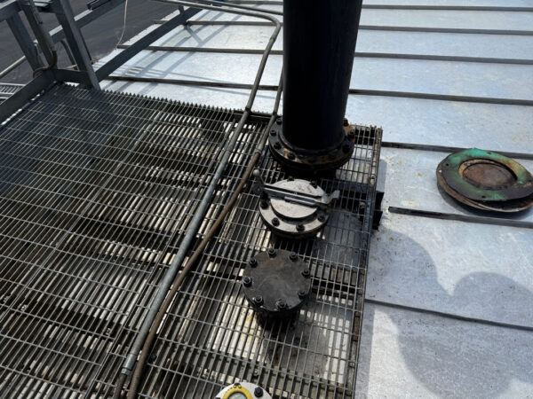 This project involved the complete cleaning and surface preparation of two industrial storage tanks' tops and upper walls using a 40-foot electric lift, pressure washing, and specialized detergents to remove mold, mildew, and dirt.