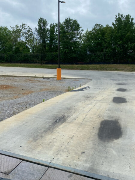 Professional surface washing and detergent treatment were performed on the concrete entrance and exit pads of a commercial scale in Chattanooga to remove organic buildup while strictly adhering to site-specific exclusion zones.