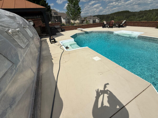 This comprehensive exterior restoration in Soddy-Daisy utilized professional soft-wash and pressure washing techniques to clean the home's siding, concrete surfaces, pool deck, three wood decks, patio furniture, retaining walls, and both interior and exterior windows.