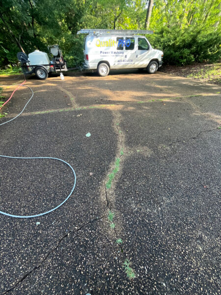 This project involved a comprehensive exterior cleaning of a Chattanooga residence's retaining wall, patio pavers, driveway, and front porch using specialized detergents and pressure washing to remove organic growth and surface debris.