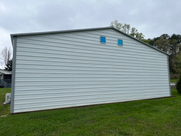 Professional soft wash exterior cleaning will be performed on the main house, porches, and three garage buildings, targeting all vertical surfaces and roofline components to remove organic growth and debris with a one-year warranty.