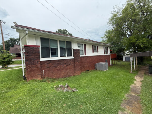 This project involved a comprehensive soft wash of a two-story Chattanooga residence and its wood deck, utilizing low-pressure detergent applications to safely and effectively remove organic growth, dirt, and stains from all exterior surfaces.
