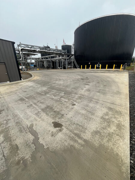 Professional surface washing and detergent treatment were performed on the concrete entrance and exit pads of a commercial scale in Chattanooga to remove organic buildup while strictly adhering to site-specific exclusion zones.