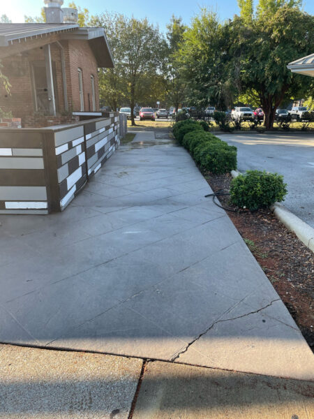 The project at Urban Stack in Chattanooga involved inspecting and thoroughly pressure washing the restaurant's exterior sidewalks, dining patios, and side entrance to remove dirt, stains, and grease, thereby restoring a clean appearance and improving pedestrian safety.