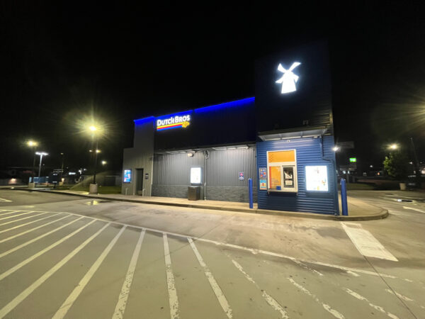 This commercial building in Chattanooga receives a biannual, low-pressure soft wash treatment to remove organic growth and debris from its masonry facade while preserving the integrity of the structure.