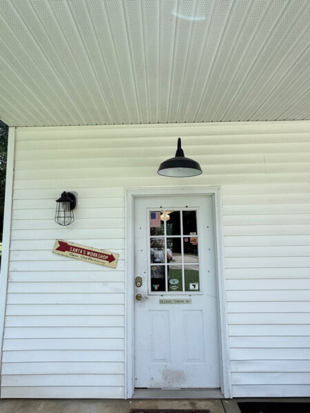 The contractor performed a comprehensive exterior cleaning in Chickamauga, utilizing soft washing for the home and workshop siding and professional surface cleaning for all concrete driveways, walkways, and patios.
