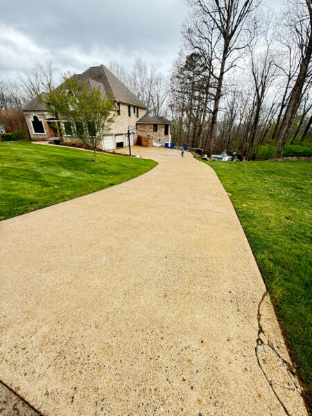 The work performed consists of soft washing and rinsing the primary structure's exterior surfaces, three rear decks, a treehouse with its decks and bridges, and surface cleaning the concrete flatwork, all backed by a one-year warranty against mold and mildew regrowth.