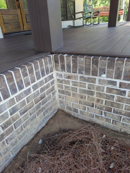A complete exterior soft wash was performed on a one-story residence in Rising Fawn, thoroughly cleaning the soffits, fascia, gutters, downspouts, and siding using a low-pressure system and gentle agitation to safely remove organic growth and dirt.