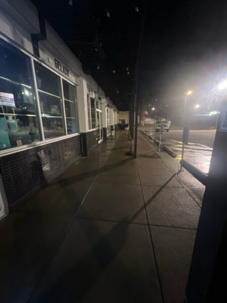The front patio concrete at Milk and Honey was professionally restored through a multi-step process involving site protection, specialized detergent application, targeted pressure washing, and a final rinse to remove organic growth and grease.