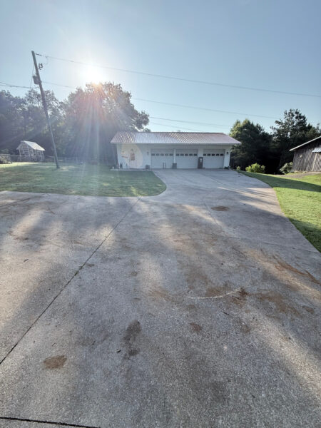 The contractor performed a comprehensive exterior cleaning in Chickamauga, utilizing soft washing for the home and workshop siding and professional surface cleaning for all concrete driveways, walkways, and patios.
