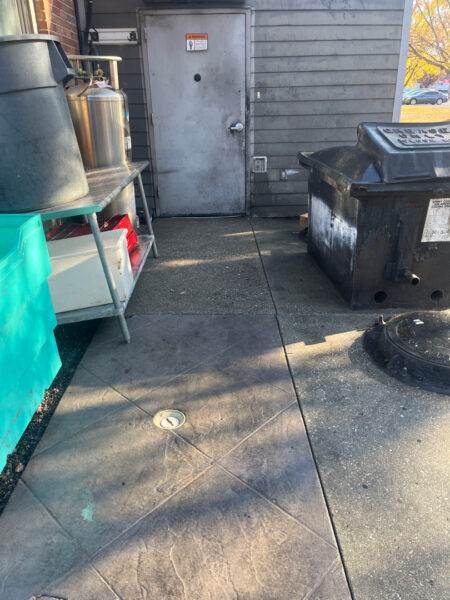The project at Urban Stack in Chattanooga involved inspecting and thoroughly pressure washing the restaurant's exterior sidewalks, dining patios, and side entrance to remove dirt, stains, and grease, thereby restoring a clean appearance and improving pedestrian safety.