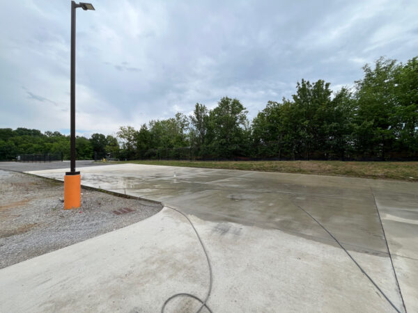 Professional surface washing and detergent treatment were performed on the concrete entrance and exit pads of a commercial scale in Chattanooga to remove organic buildup while strictly adhering to site-specific exclusion zones.