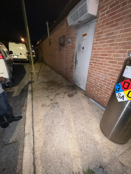 This project involved pressure washing a Chattanooga restaurant's front sidewalk, customer patio, and dumpster area using a municipal fire hydrant water source to remove dirt, stains, and grease for a cleaner appearance.