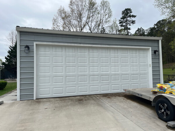 Professional soft wash exterior cleaning will be performed on the main house, porches, and three garage buildings, targeting all vertical surfaces and roofline components to remove organic growth and debris with a one-year warranty.
