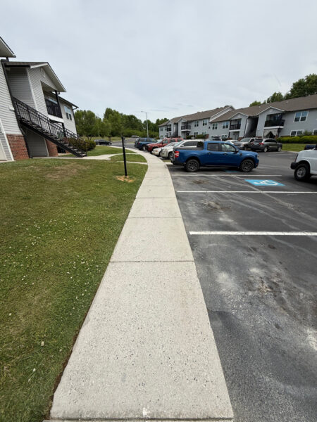 This project involved a comprehensive exterior soft wash and pressure cleaning of an apartment community in Cleveland, restoring the buildings, breezeways, concrete walkways, mail center, dumpster pads, and clubhouse to a clean and refreshed condition.