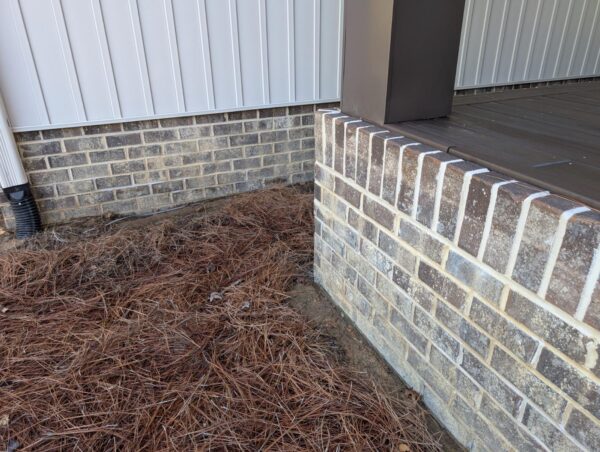 A complete exterior soft wash was performed on a one-story residence in Rising Fawn, thoroughly cleaning the soffits, fascia, gutters, downspouts, and siding using a low-pressure system and gentle agitation to safely remove organic growth and dirt.