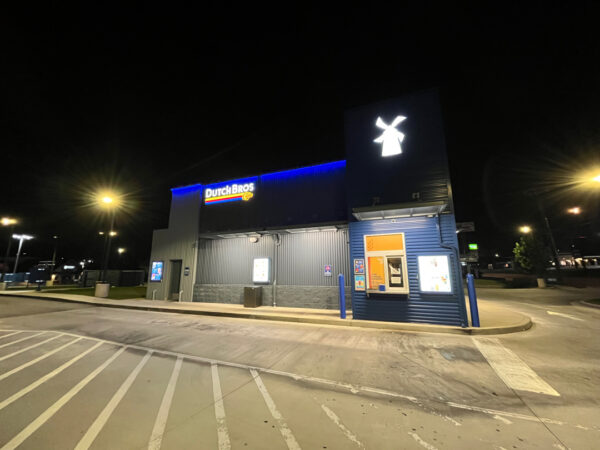 This commercial building in Chattanooga receives a biannual, low-pressure soft wash treatment to remove organic growth and debris from its masonry facade while preserving the integrity of the structure.