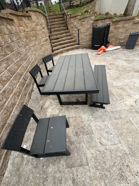 The work performed consists of soft washing and rinsing the primary structure's exterior surfaces, three rear decks, a treehouse with its decks and bridges, and surface cleaning the concrete flatwork, all backed by a one-year warranty against mold and mildew regrowth.