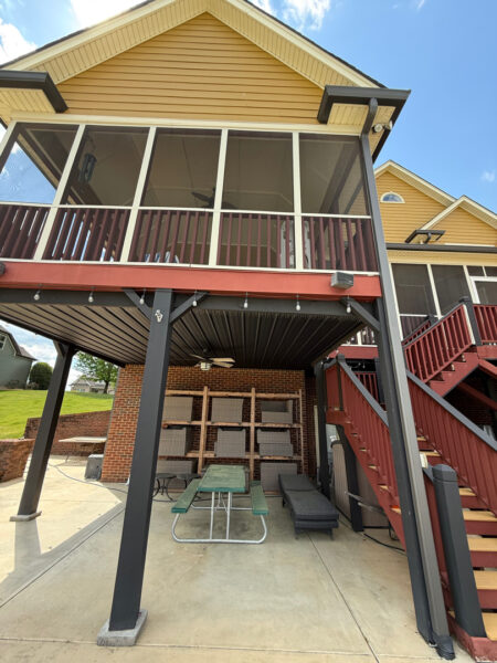 This comprehensive exterior restoration in Soddy-Daisy utilized professional soft-wash and pressure washing techniques to clean the home's siding, concrete surfaces, pool deck, three wood decks, patio furniture, retaining walls, and both interior and exterior windows.