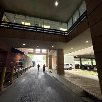 This project encompassed an exterior refresh of a Chattanooga commercial property through power washing structural surfaces, repainting pedestrian bridge handrails, pressure washing concrete areas, and hand-cleaning second-story windows.