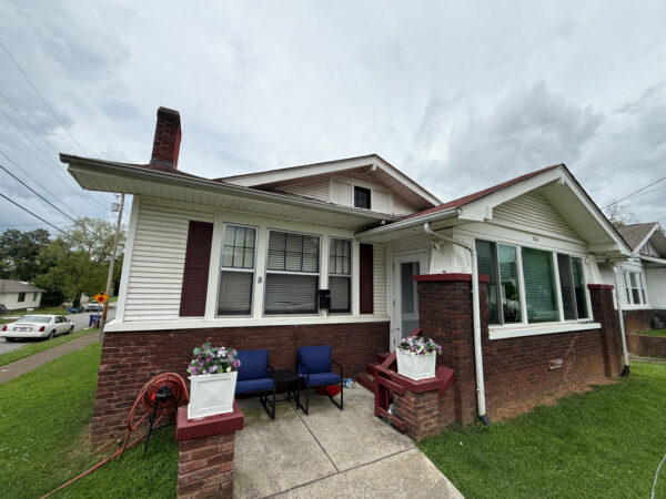 This project involved a comprehensive soft wash of a two-story Chattanooga residence and its wood deck, utilizing low-pressure detergent applications to safely and effectively remove organic growth, dirt, and stains from all exterior surfaces.