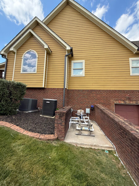This comprehensive exterior restoration in Soddy-Daisy utilized professional soft-wash and pressure washing techniques to clean the home's siding, concrete surfaces, pool deck, three wood decks, patio furniture, retaining walls, and both interior and exterior windows.