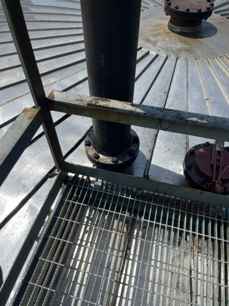 This project involved the complete cleaning and surface preparation of two industrial storage tanks' tops and upper walls using a 40-foot electric lift, pressure washing, and specialized detergents to remove mold, mildew, and dirt.