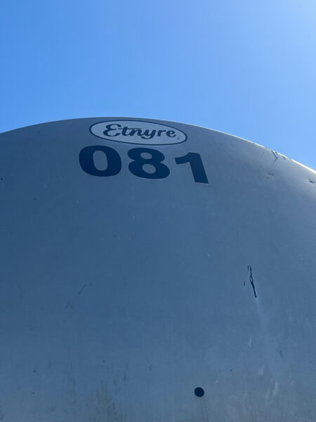 This project involved the complete cleaning and surface preparation of two industrial storage tanks' tops and upper walls using a 40-foot electric lift, pressure washing, and specialized detergents to remove mold, mildew, and dirt.