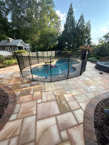 This project involved a comprehensive soft wash and detailed exterior cleaning of a Chattanooga residence, encompassing the house, porches, concrete surfaces, gutters, and outbuildings to remove organic buildup and restore a uniform appearance.