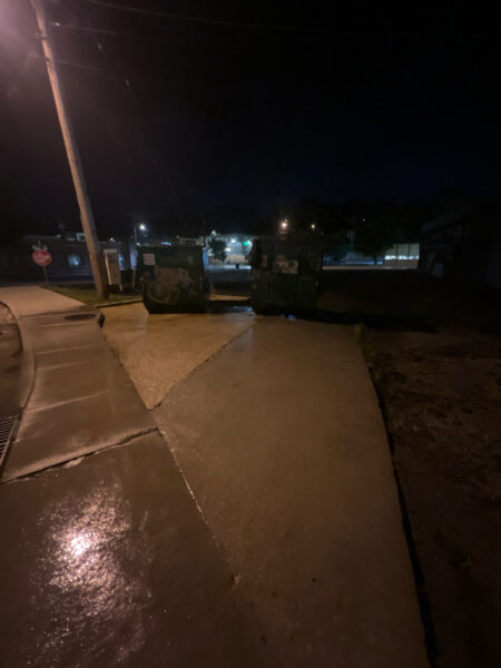 This project involved pressure washing a Chattanooga restaurant's front sidewalk, customer patio, and dumpster area using a municipal fire hydrant water source to remove dirt, stains, and grease for a cleaner appearance.