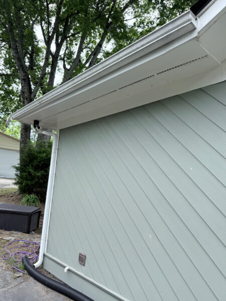 This project involved a comprehensive soft wash cleaning of a one-story residence, metal garage, and wood deck in Chattanooga to remove organic growth and dirt while preserving the integrity of all exterior surfaces.