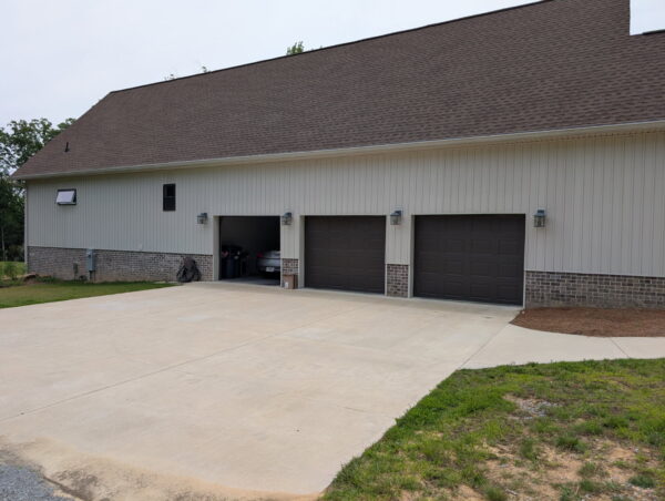 A complete exterior soft wash was performed on a one-story residence in Rising Fawn, thoroughly cleaning the soffits, fascia, gutters, downspouts, and siding using a low-pressure system and gentle agitation to safely remove organic growth and dirt.