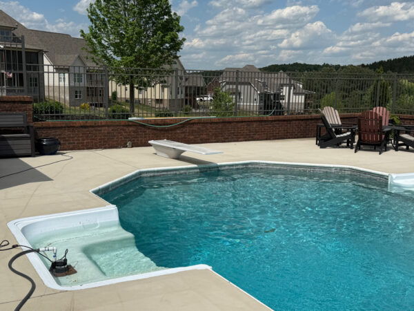 This comprehensive exterior restoration in Soddy-Daisy utilized professional soft-wash and pressure washing techniques to clean the home's siding, concrete surfaces, pool deck, three wood decks, patio furniture, retaining walls, and both interior and exterior windows.