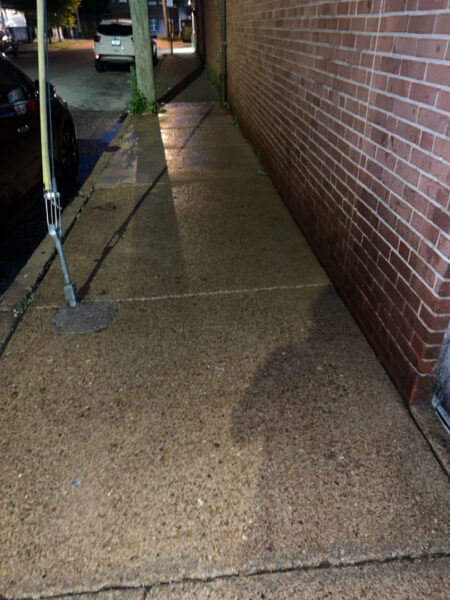 This project involved pressure washing a Chattanooga restaurant's front sidewalk, customer patio, and dumpster area using a municipal fire hydrant water source to remove dirt, stains, and grease for a cleaner appearance.